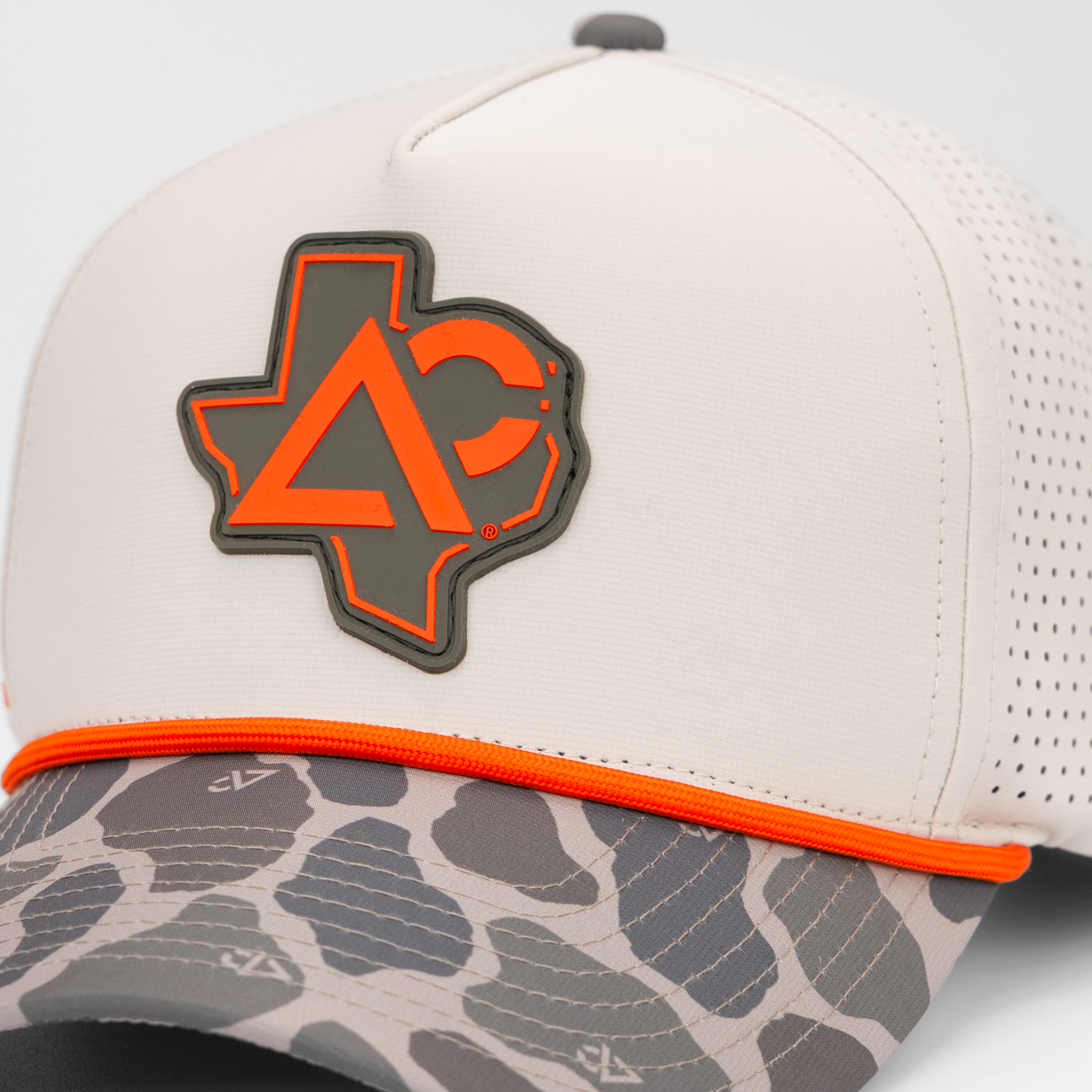 Natural hat with duck camo bill closeup of Texas Archery Country patch on front