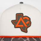 Natural hat with duck camo bill closeup of Texas Archery Country patch on front