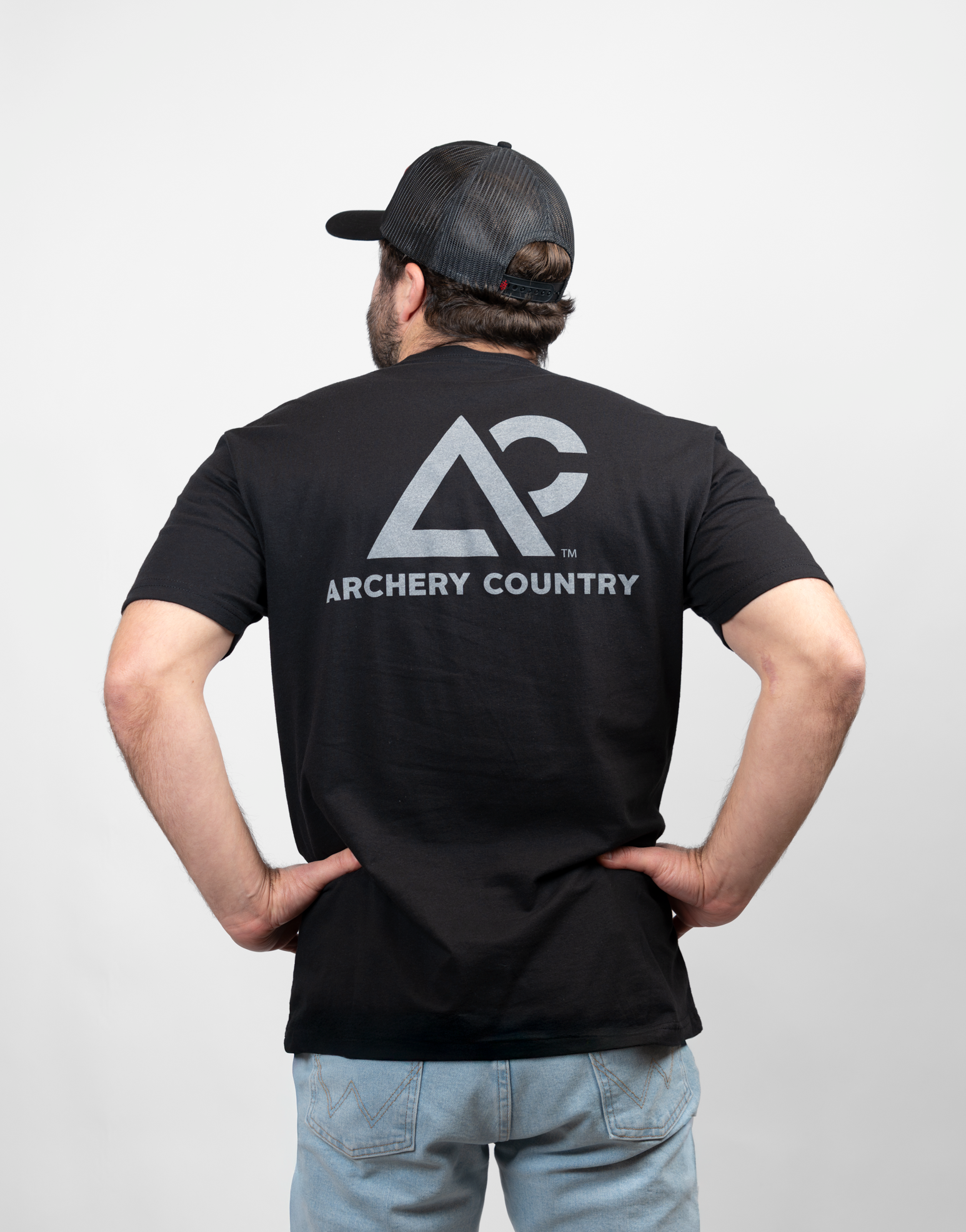 Person wearing a black t-shirt with 'Archery Country' logo on the back, standing against a plain background.