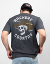 Rear view of man wearing charcoal tee with graphic of  a skull wearing a cowboy hat with an arrow through it with text "ARCHERY COUNTRY AUSTIN TEXAS"