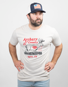 Man wearing sand tee with "ARCHERY COUNTRY Austin, TX" text and graphic of a deer