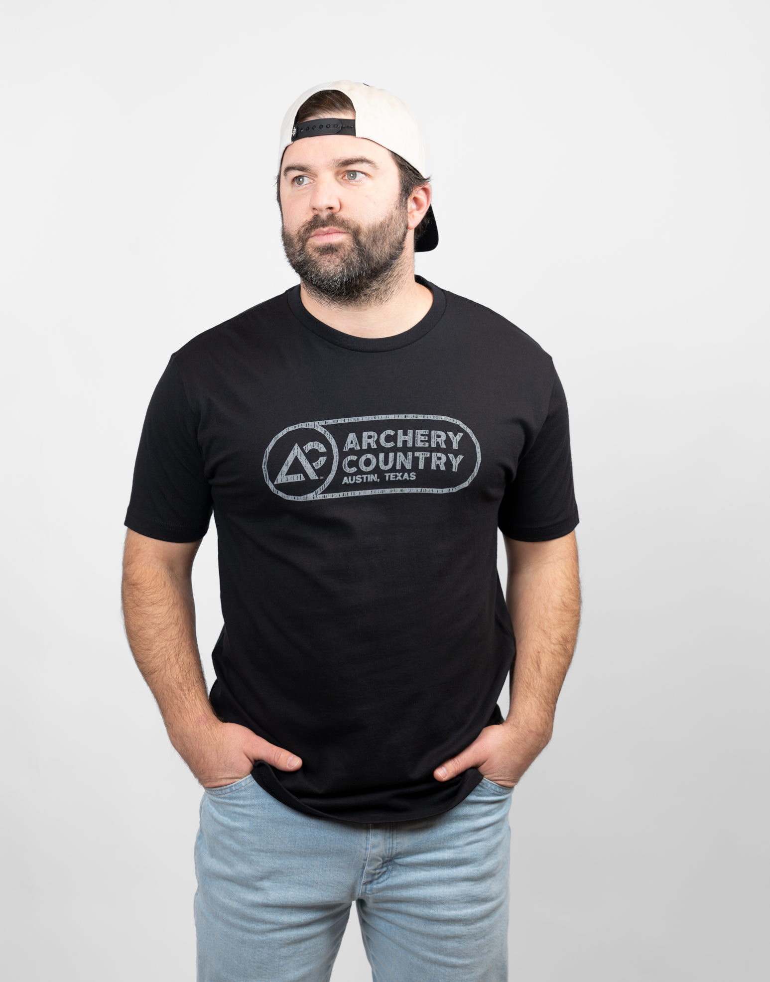 Man wearing a black t-shirt with 'Archery Country' logo on a white background