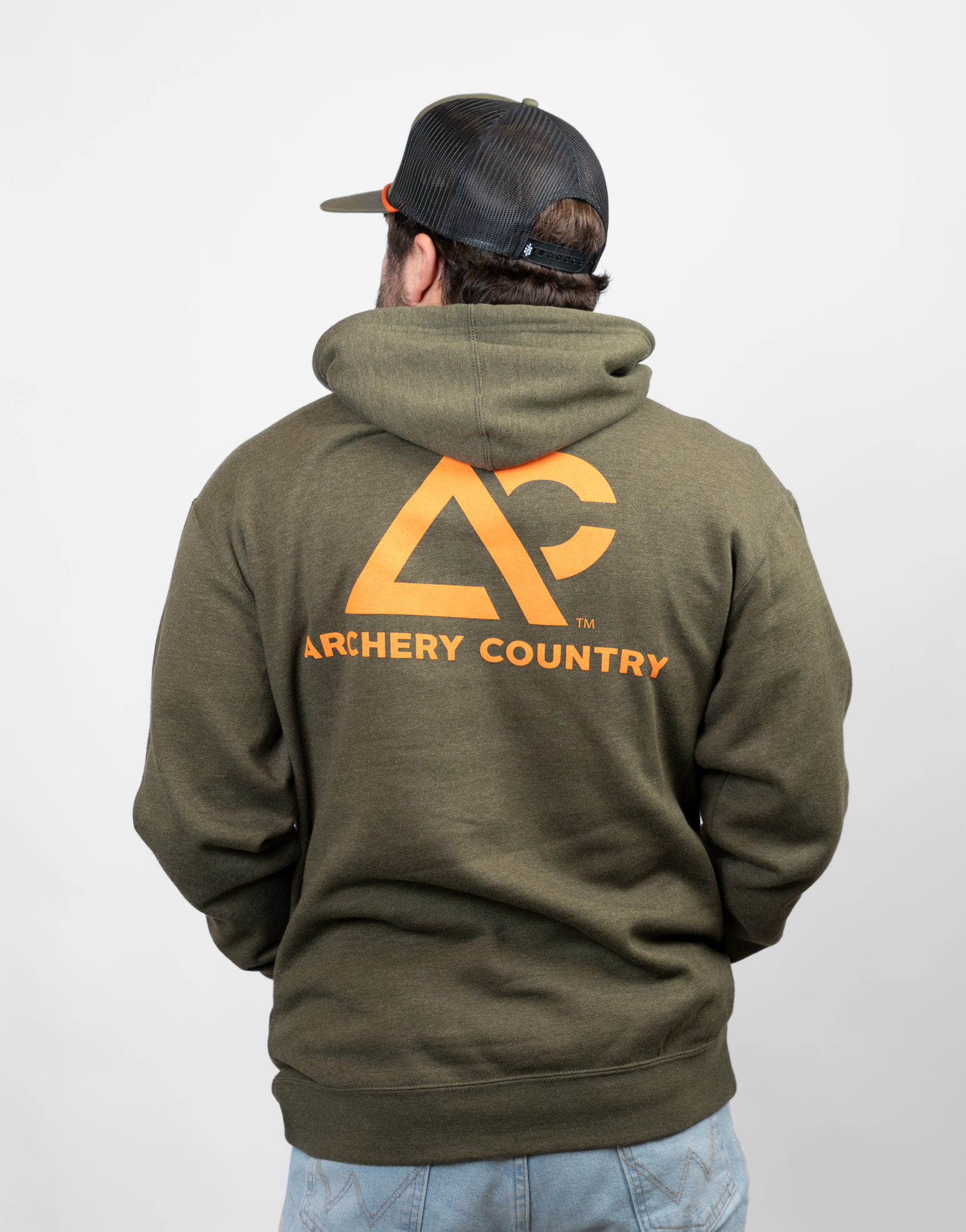 Person wearing a green hoodie with orange 'Archery Country' logo on the back 