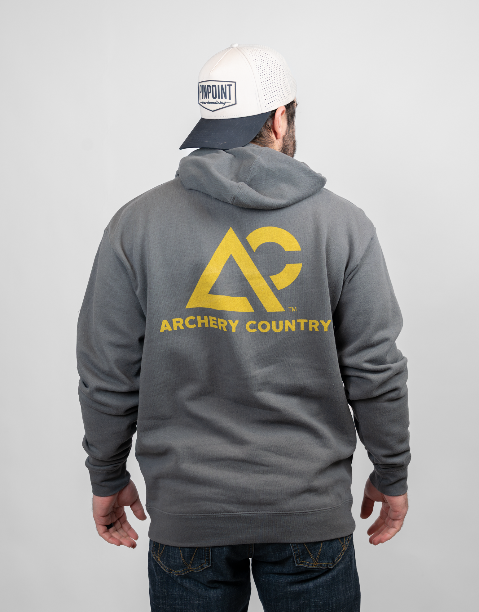 Person wearing a charcoal hoodie with 'Archery Country' logo on the back, standing against a plain background.