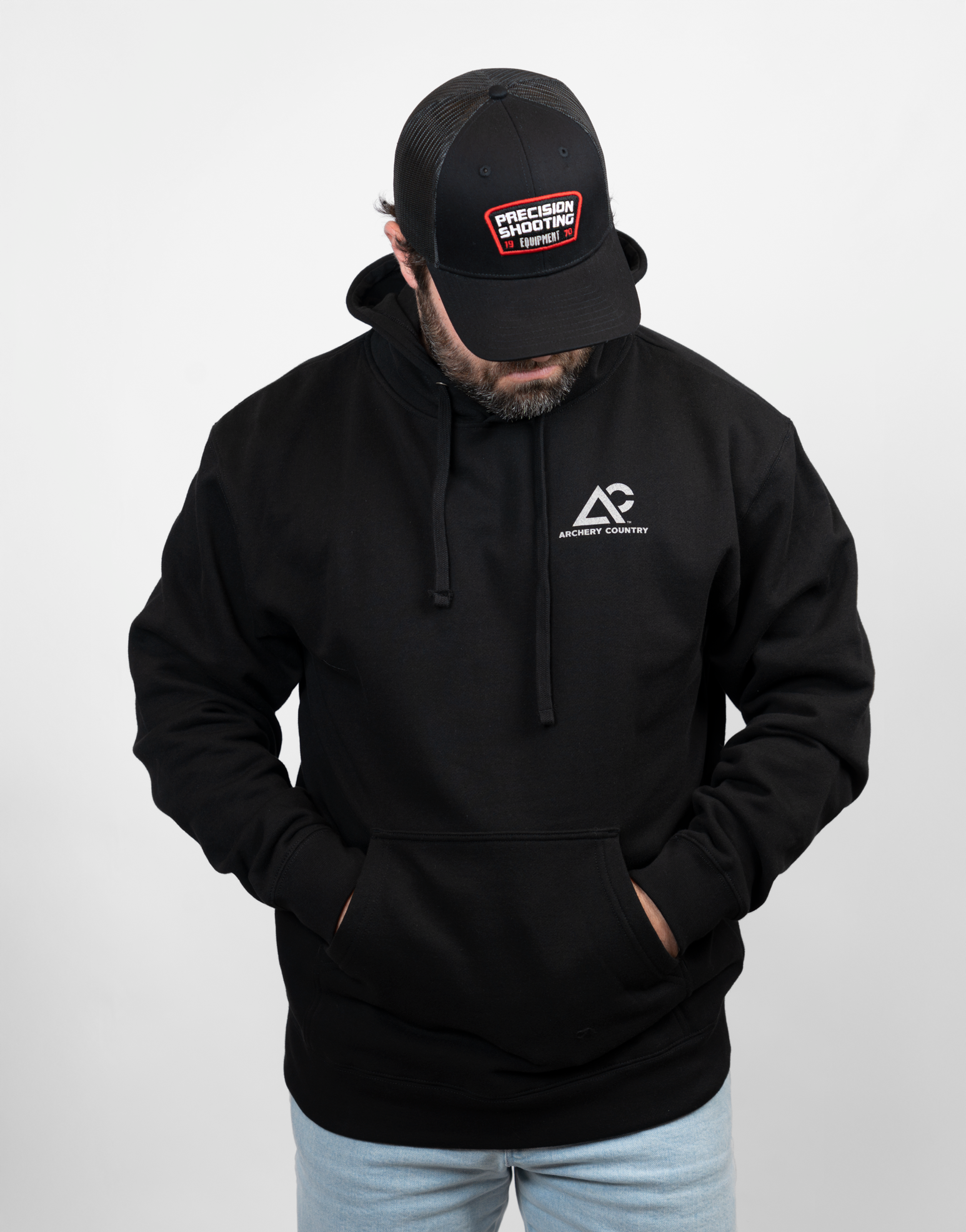 Man wearing black hoodie with Archery Country logo on left chest