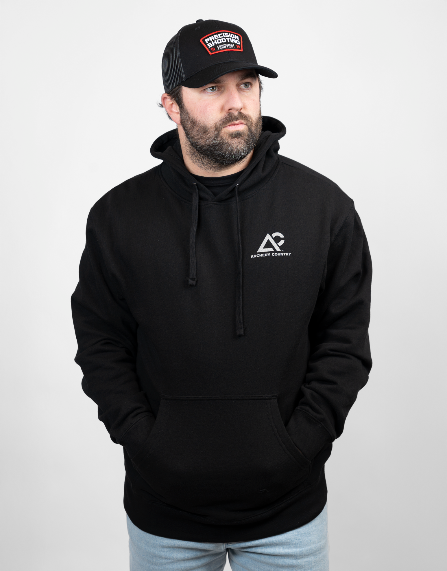 Man wearing black hoodie with Archery Country logo on left chest