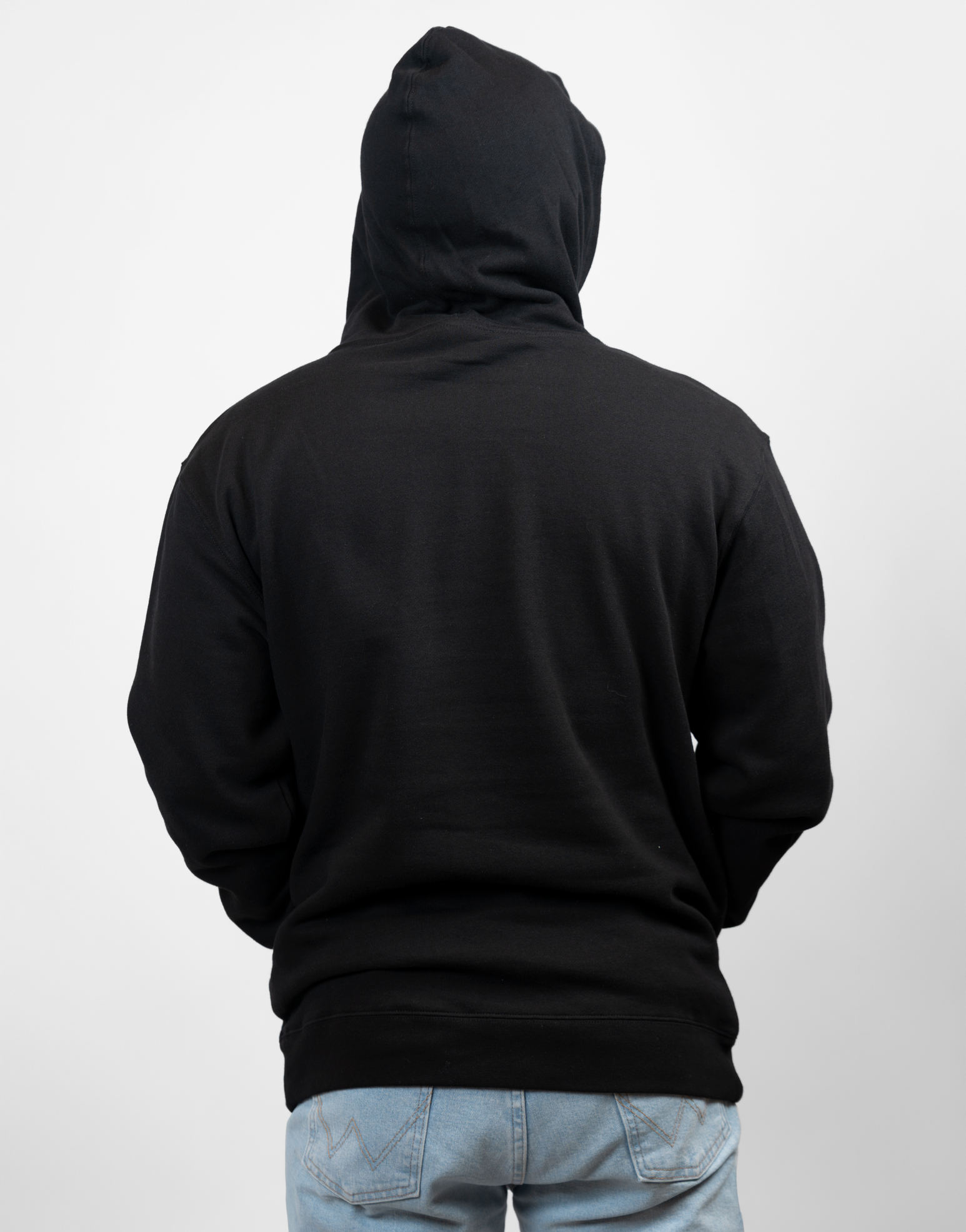 rear view of man wearing black hoodie